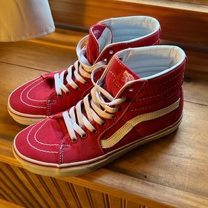 Woman’s/men’s red high top vans